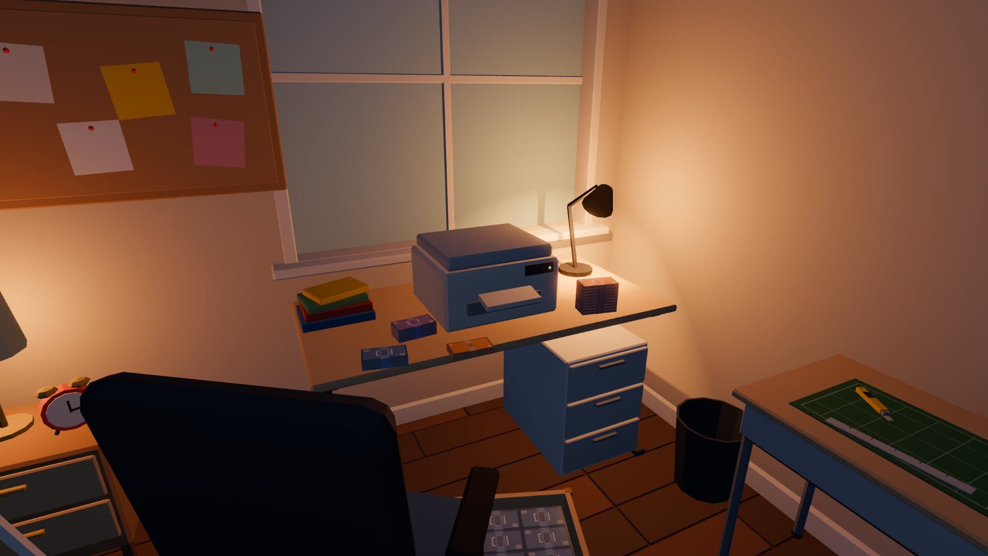 Eye-level view of the printer desk and its drawers by the window, with a cutting mat on a side table.